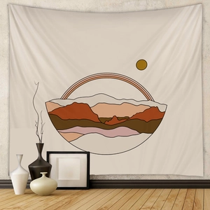Detail view of Bohemian wall tapestry with abstract mountains and sun in warm earth tones