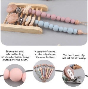 Detailed view of silicone beads and beech wood clip for infant pacifier chain