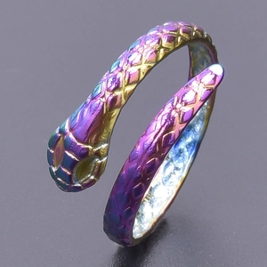Detailed macro view of the iridescent snake ring featuring intricate scale textures