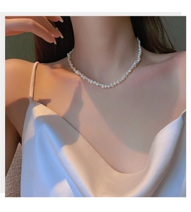 Elegant model shot of irregular baroque freshwater pearl necklace on neck