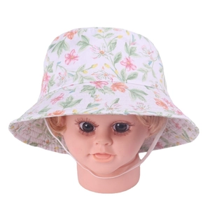 Close-up of floral print baby sun hat with pink flowers and white chin strap cord