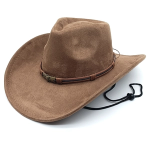 Detail of brown faux suede cowboy hat featuring star metal studs and braided strap