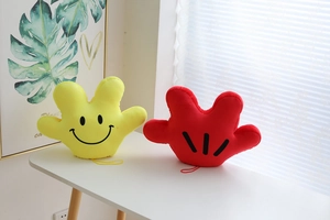 Detail of yellow and red plush palm props with hanging cords for interactive dance shows