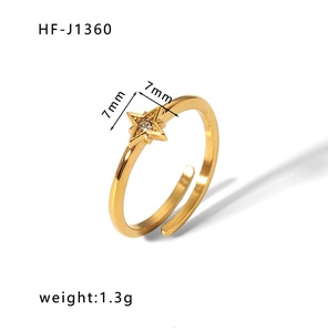Detailed view of gold star ring with zircon inlay showing 1.3g weight and 7mm size specs