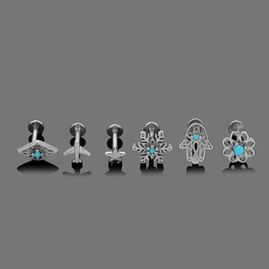 Detail view of 6-piece vintage turquoise stud set in polished stainless steel for piercings