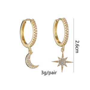 Detail of asymmetric copper moon and star earrings with cubic zirconia, 2.6cm drop length