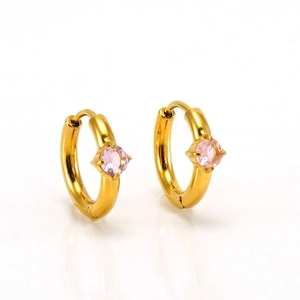 Detail of gold-plated hoop earrings featuring a round pink zircon in a classic 4-prong setting