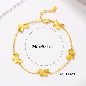 Detailed view of gold butterfly charm bracelet with textured wings and 24cm adjustable chain