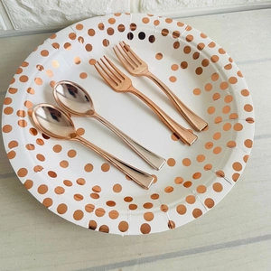 Disposable 9.8cm rose gold plastic forks and spoons set on a polka dot paper plate