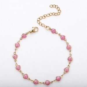 Detail of 18K gold plated chain featuring thirteen pink glitter heart-shaped pendants