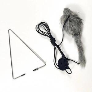 Detail of grey plush toy mouse with elastic string and metal hook for cats