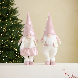 Pink and beige Christmas gnome couple figures with metallic fabric and glowing lights