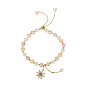 Irregular freshwater pearl bracelet with zircon daisy pendant and adjustable gold clasp