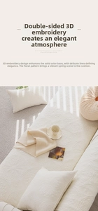 Close-up of cream washed cotton sofa cover featuring exquisite 3D floral embroidery