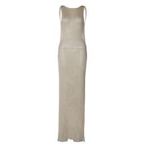 Detail of elegant metallic knit long dress with sheer texture and side slit design
