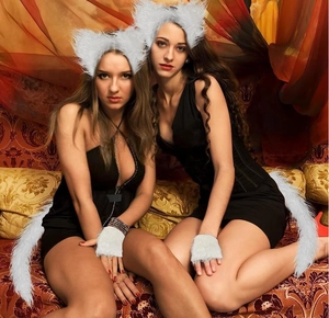 Detail of soft white faux fur wolf ears headband, gloves, and tail for cosplay costumes