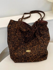 Large leopard print tote bag with soft suede texture and gold logo plaque detail