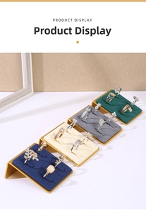 Detail view of four-color velvet ring display stands with gold metal L-shaped bases