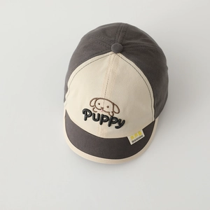 Close-up of cute puppy embroidery and puppy lettering on a two-tone baby baseball cap