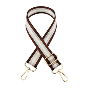 Adjustable woven strap for bags with brown white and silver stripes and gold metal hooks