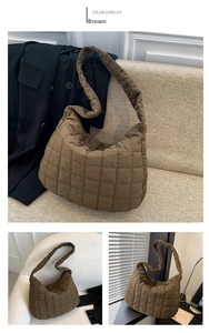 Close-up of brown quilted tote bag in padded space cotton material with square stitching