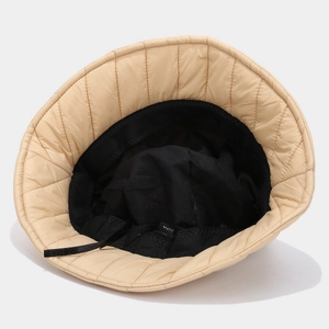 Quilted down bucket hat in beige with black lining and inner adjustable drawstring