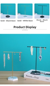 T-bar metal jewelry stands with marble bases for organizing necklaces and earrings