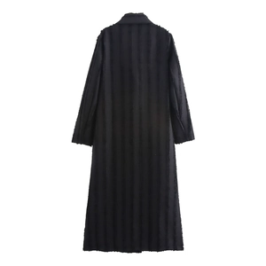 Detailed back view of a long black coat featuring unique vertical fringe distressed texture