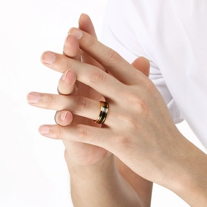 Detail of matte gold and black tungsten steel ring showing sleek brushed finish and dual tones