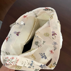 Detail view of cotton tote bag interior with magnetic closure and inner pocket