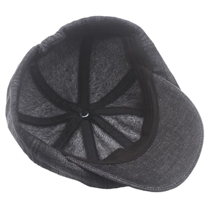 Internal view of denim newsboy cap showing reinforced black tapes and sweatband details