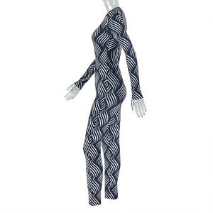 Close-up of blue and white wave print fabric on a tight-fitting long sleeve jumpsuit