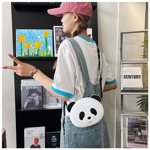 Detailed view of a cute panda crossbody bag for kids with stylish black and white strap