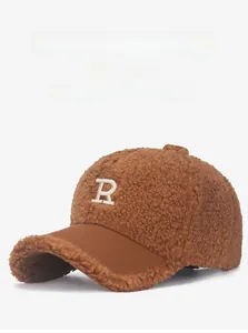 Close-up of brown teddy fleece baseball cap with white embroidered R letter logo
