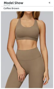 Detail of coffee brown yoga bra with cross back and high waist leggings on model