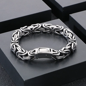 Macro shot of silver Byzantine chain bracelet in titanium steel with a secure box clasp