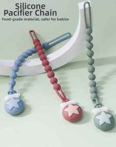 Close-up of food-grade silicone pacifier clips with star buckles in Morandi colors