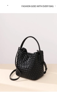 Detail of black hand-woven bucket bag showing intricate leather texture and magnetic closure