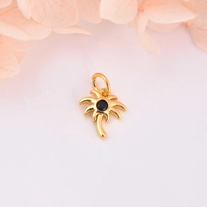 Gold palm tree pendant with black zircon stone for DIY jewelry making on pink background