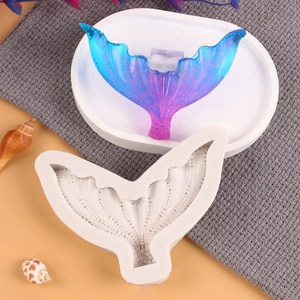 Detail of mermaid tail silicone mold with gradient resin fish tail on white tray