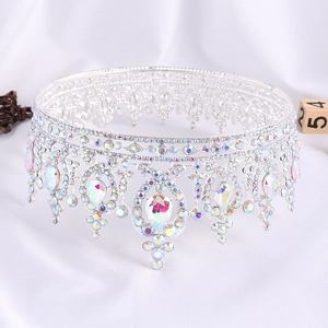 Macro shot of silver bridal crown with colorful crystals and teardrop pendants