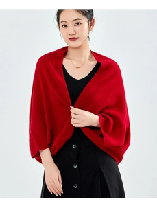 Detail view of the soft knitted texture on this warm red cashmere shawl for winter