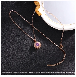 Macro detail of rose gold titanium necklace with purple sunburst zirconia pendant