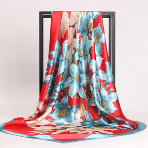 Floral silk scarf with blue lily print on bright red satin fabric for women