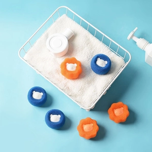 Blue and orange bear-shaped laundry sponge balls for washing machine hair removal