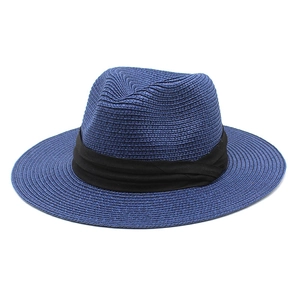Detail of navy straw Panama hat with wide black fabric band for sun protection