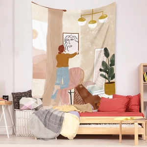 Detail of bohemian tapestry featuring modern minimalist illustration in a cozy home setting