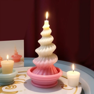 Spiral twisted Christmas tree candle with pink gradient finish and matching tray base