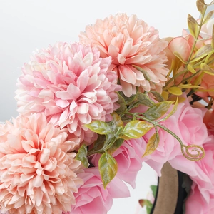 Detailed close-up of pink artificial chrysanthemum and rose floral headband for women