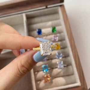 Macro view of S925 silver ring with radiant emerald-cut cubic zirconia and pave stones